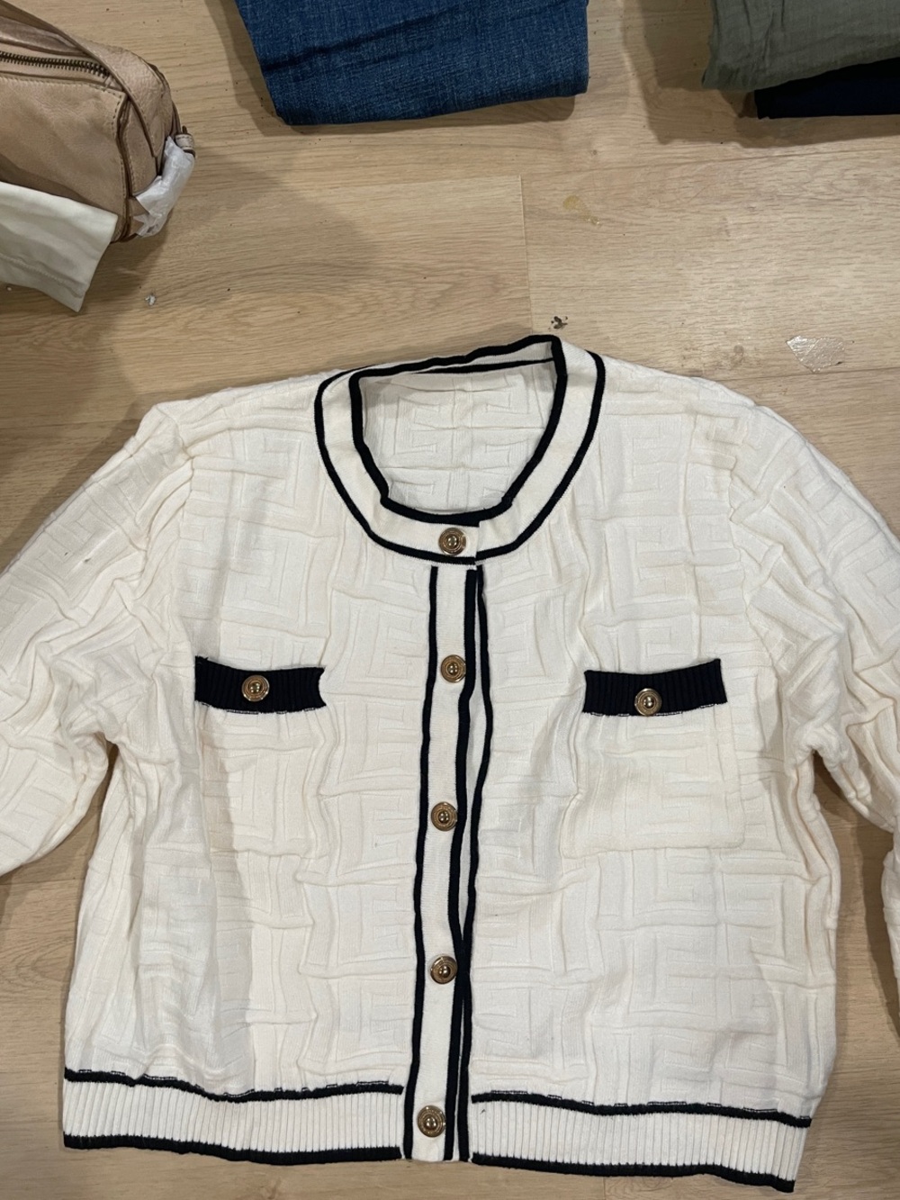 Classic Cream Knit Cardigan with Black Trim